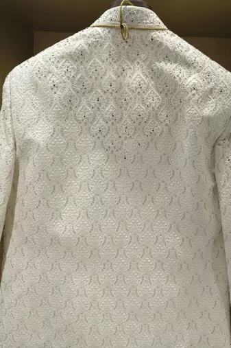 white silk sherwani with detailed hand embroidery