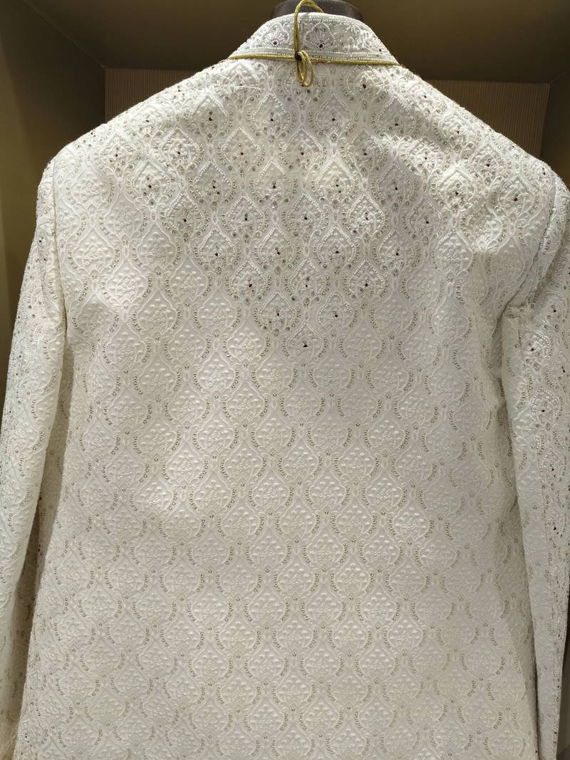 white silk sherwani with detailed hand embroidery