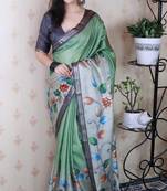 green kalamkari print tussar silk saree with zari border