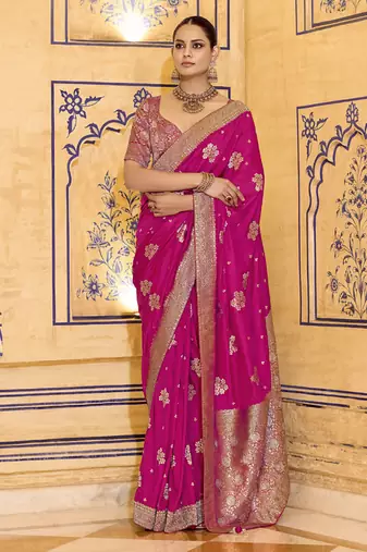 Rani pink crepe silk saree, beautifully crafted with rich zari weaving