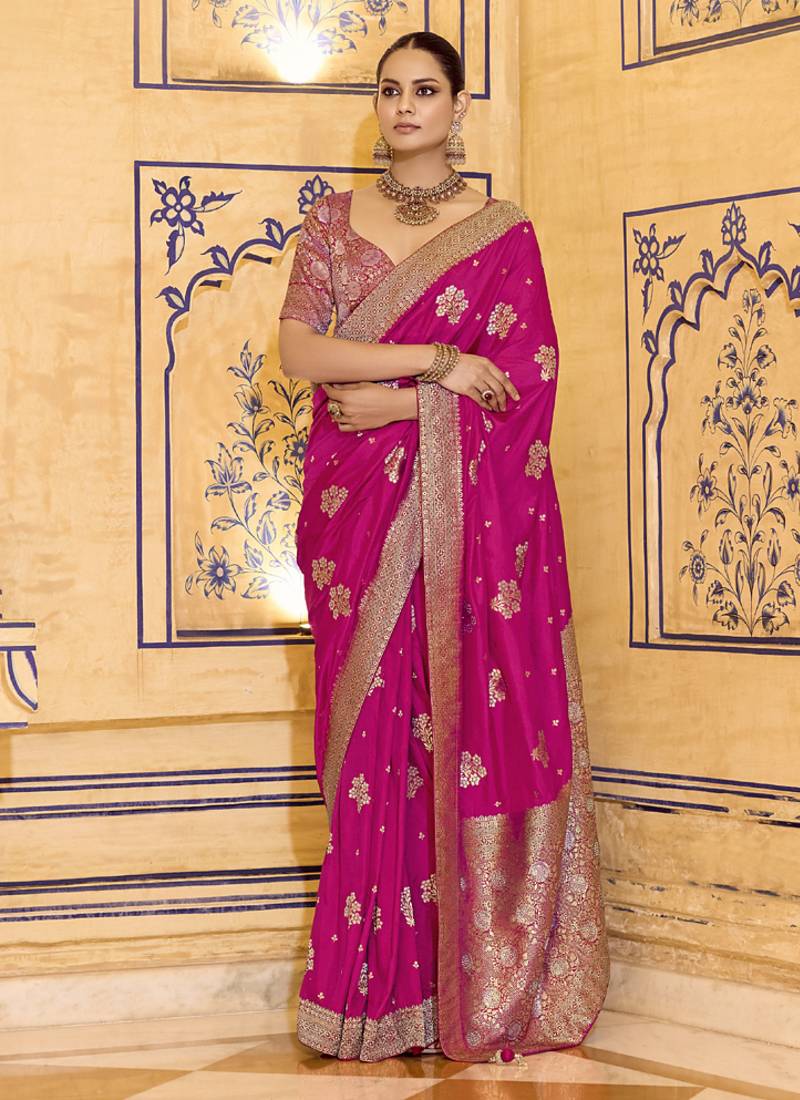 Rani pink crepe silk saree, beautifully crafted with rich zari weaving