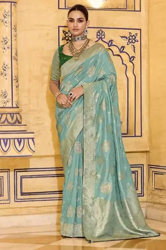 Turquoise crepe silk saree, beautifully crafted with rich zari weaving