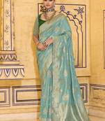 Turquoise crepe silk saree, beautifully crafted with rich zari weaving