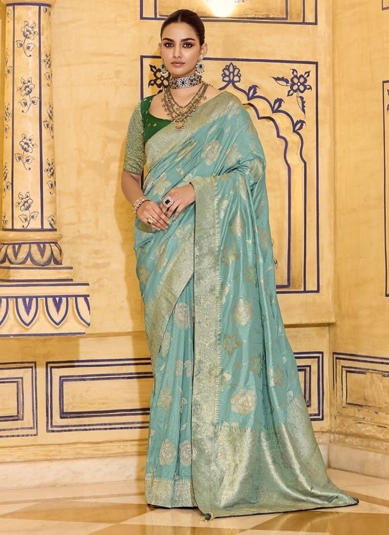 Turquoise crepe silk saree, beautifully crafted with rich zari weaving