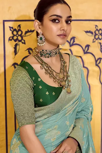 turquoise crepe silk saree with zari woven design