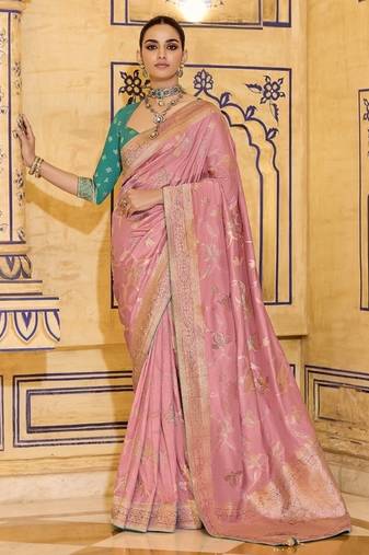Peach crepe silk saree, beautifully crafted with rich zari weaving