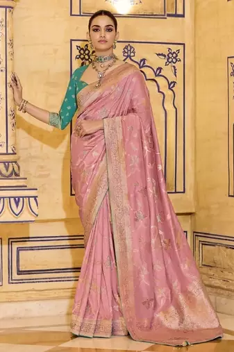 Peach crepe silk saree, beautifully crafted with rich zari weaving
