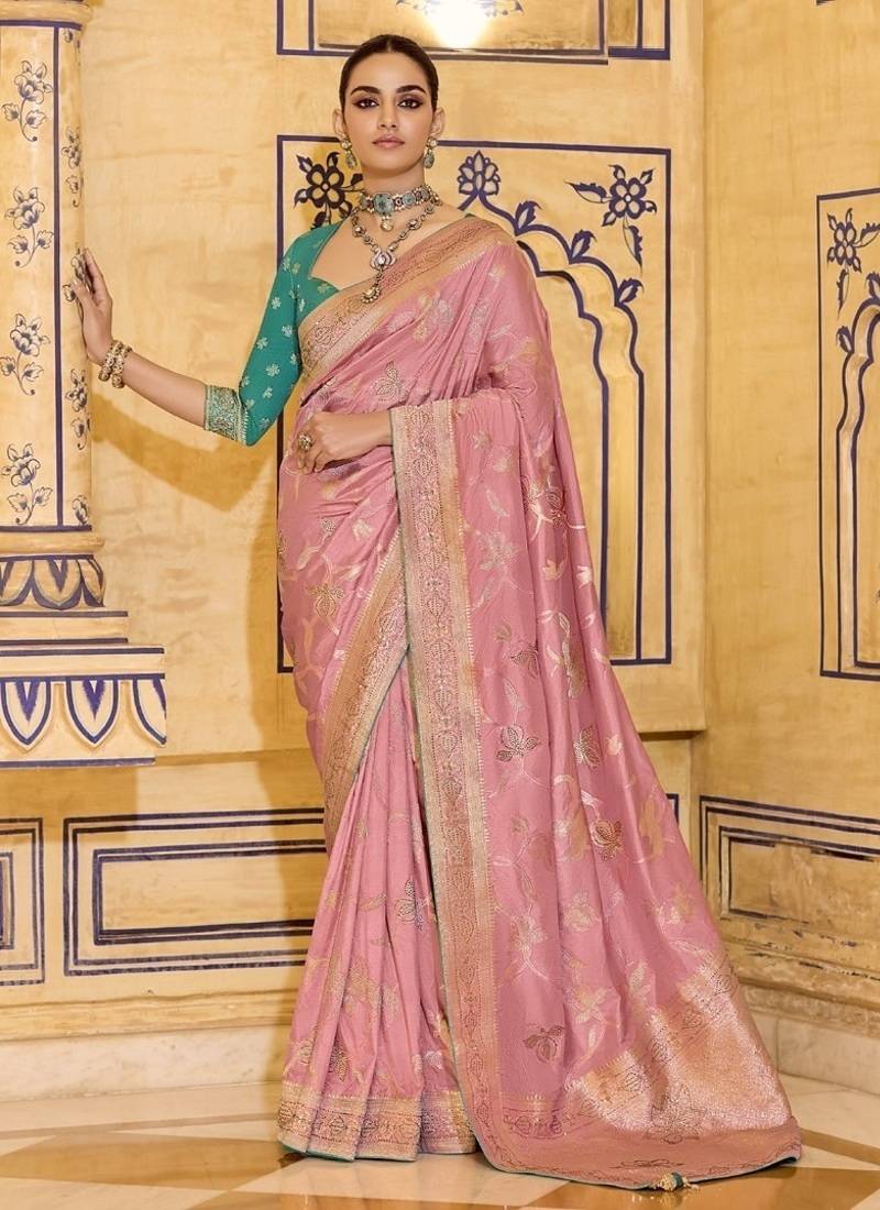 Peach crepe silk saree, beautifully crafted with rich zari weaving