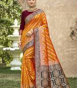 Elegant orange banarasi silk saree with maroon contrast blouse