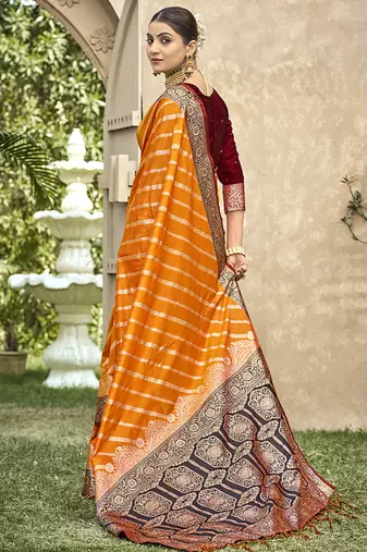 Elegant orange banarasi silk saree with maroon contrast blouse