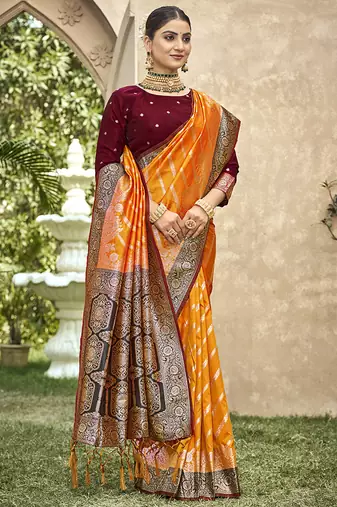 Elegant orange banarasi silk saree with maroon contrast blouse