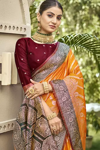 Elegant orange banarasi silk saree with maroon contrast blouse