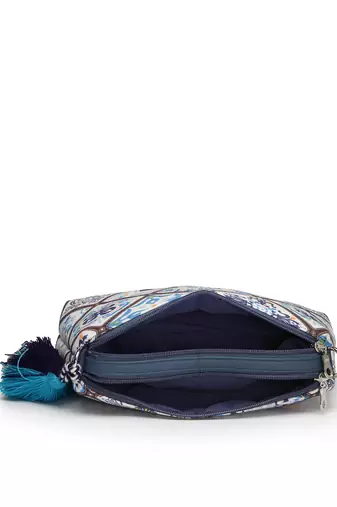blue canvas sling bag with geometric print