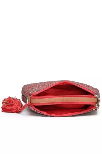 red canvas sling bag with mandala print