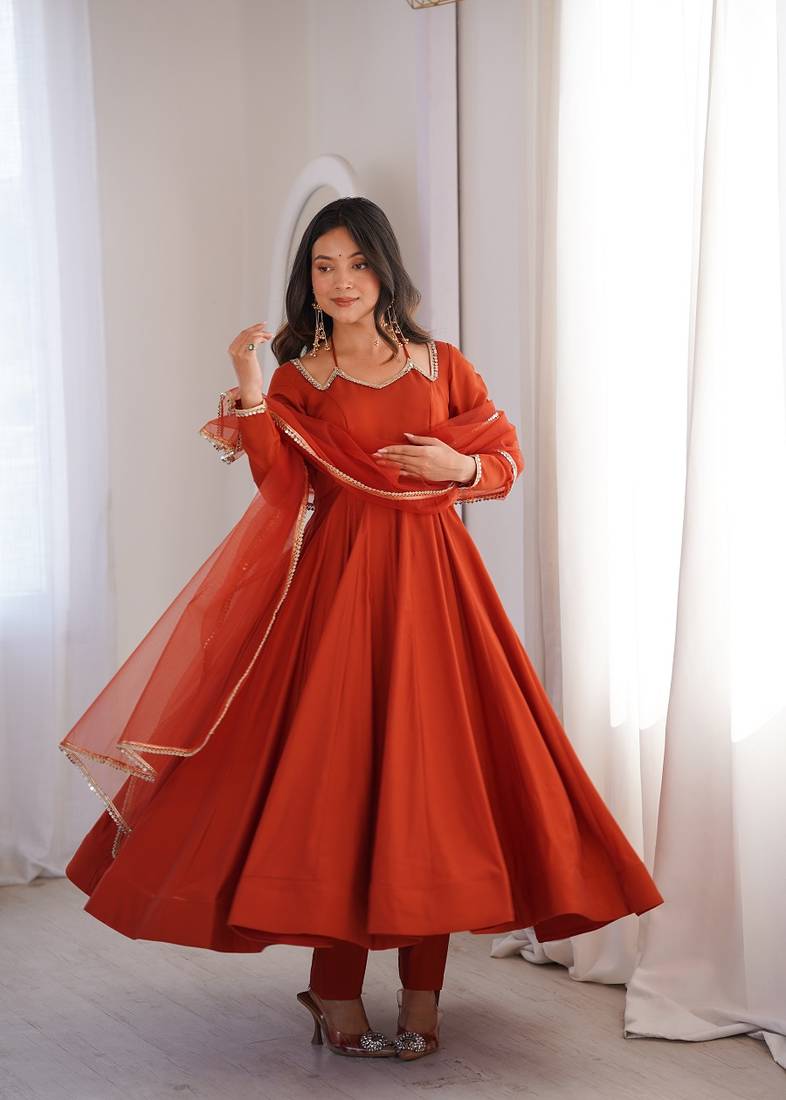 Rust orange solid roman silk chanderi fully stitched flared anarkali suit set
