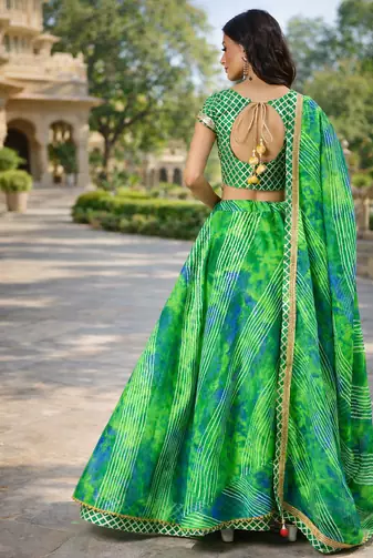 green silk lehenga with printed and lace work