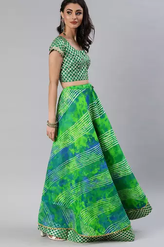 green silk lehenga with printed and lace work