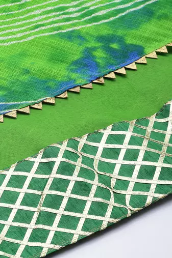 green silk lehenga with printed and lace work