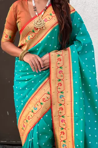 turquoise blue bandhani soft silk saree with zari weaving border