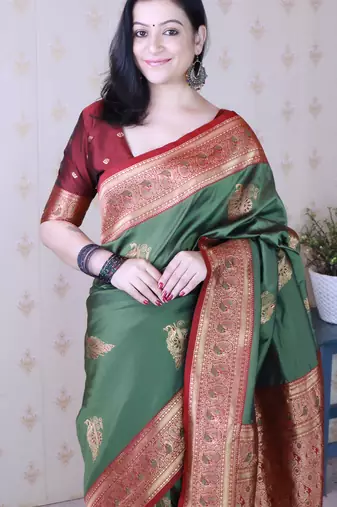 green soft silk saree with rich zari border & contrast blouse