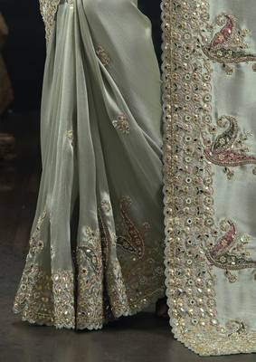  pista ziraf silk blend saree with cut dana & moti work
 2