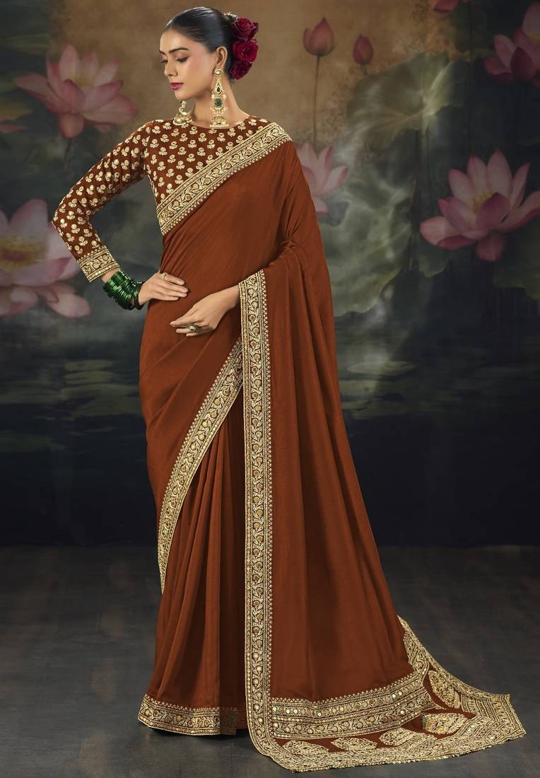 Dark orange pure muga silk saree with zari & metal sequin heavy work