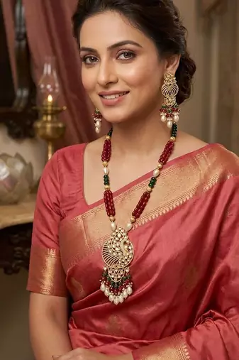 Traditional gold-plated peacock design long necklace set with red & green beads and pearl drops