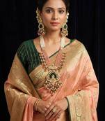 gold brass necklace set with lakshmi pendant peach bead motifs