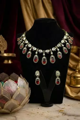 Traditional gold-plated kundan necklace set with red stone drops & matching earrings