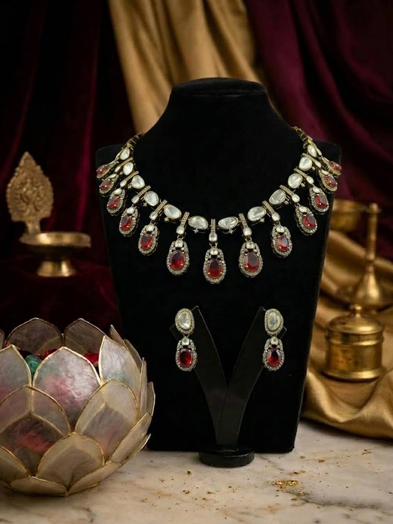 Traditional gold-plated kundan necklace set with red stone drops & matching earrings