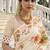 Elegant cream russian silk saree with floral position print