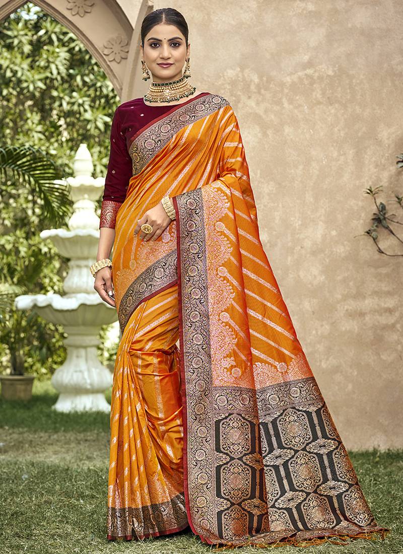 Elegant orange banarasi silk saree with maroon contrast blouse