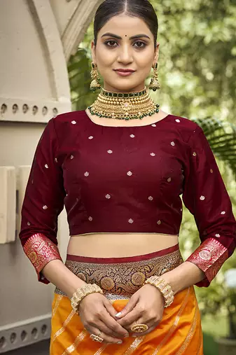 Elegant orange banarasi silk saree with maroon contrast blouse
