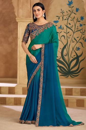 Embroidered faux chiffon teal green & blue saree