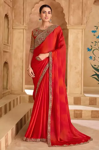 Embroidered faux chiffon shaded red saree