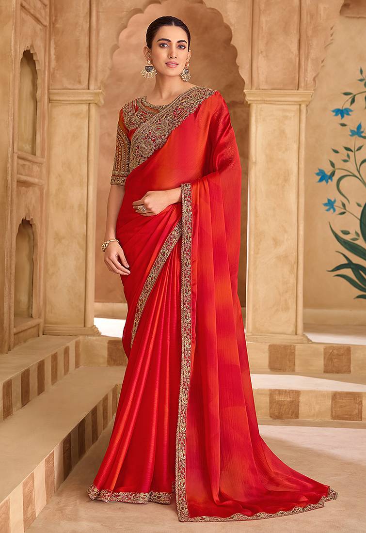 Embroidered faux chiffon shaded red saree