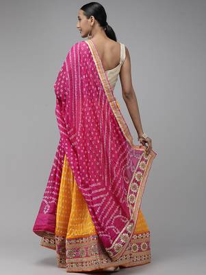 yellow silk patchwork lehenga set with pink bandhani dupatta 2