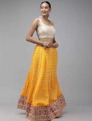 yellow silk patchwork lehenga set with pink bandhani dupatta 3