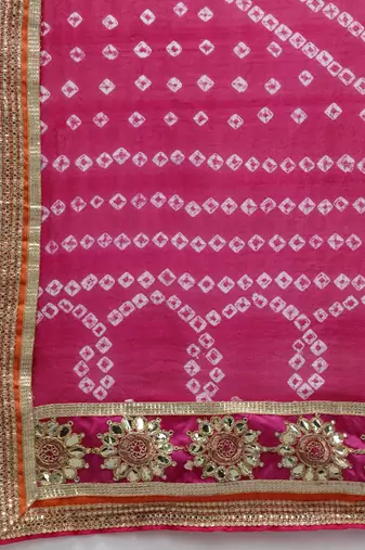 yellow silk patchwork lehenga set with pink bandhani dupatta