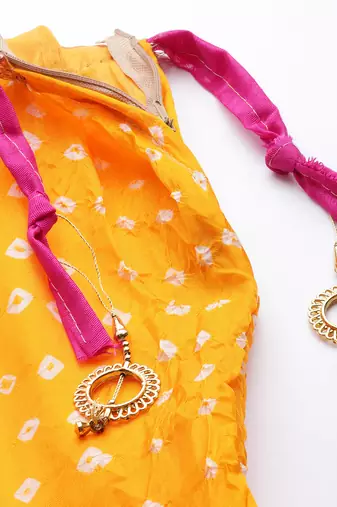 yellow silk patchwork lehenga set with pink bandhani dupatta