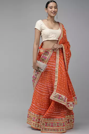 orange silk lehenga with patchwork dupatta and blouse