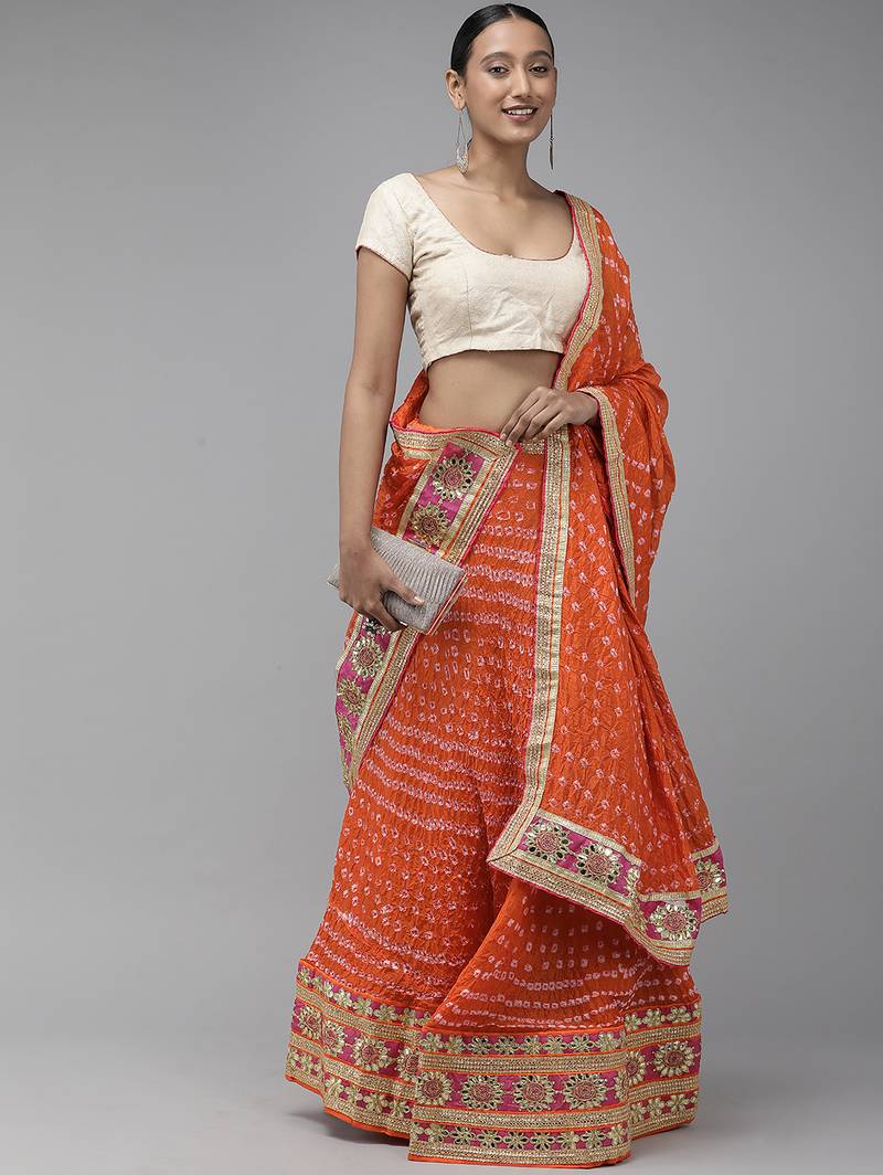 orange silk lehenga with patchwork dupatta and blouse