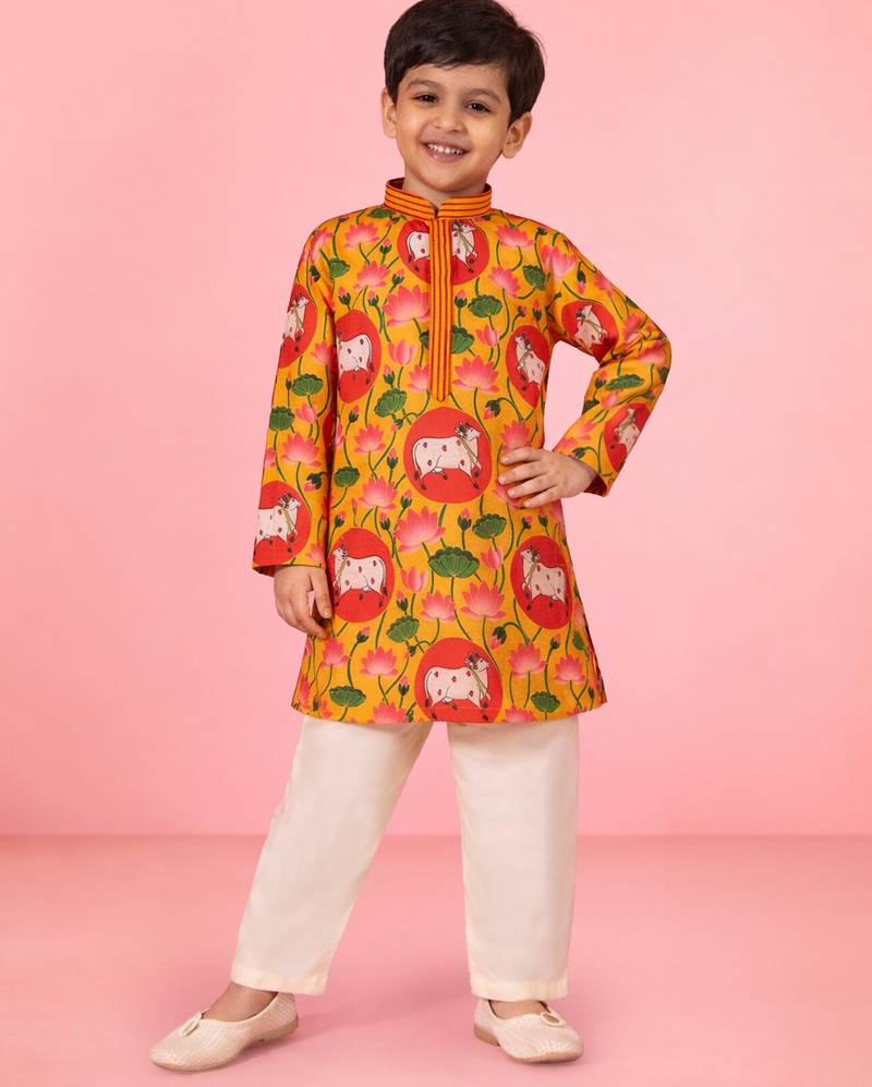 boys yellow pichwai print muslin kurta with cream pyjama     wedding & festive wear