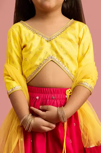 girls red net lehenga choli with foil print