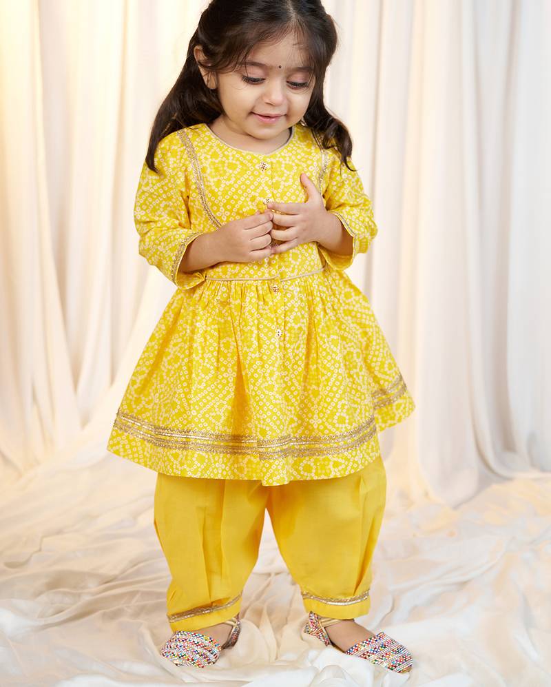 girls wear yellow bandhani cotton kurta with patiala set cotton