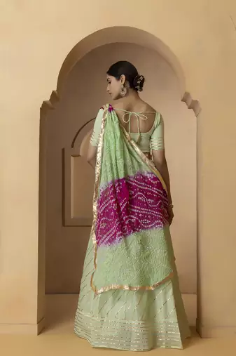 green and fuchsia silk lehenga with blouse and dupatta set