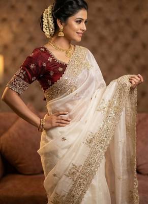 white satin saree with embroidery and heavy border 1