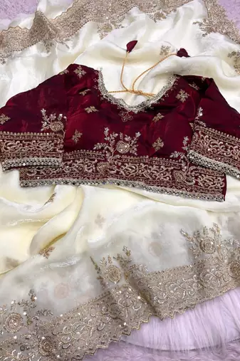 white satin saree with embroidery and heavy border