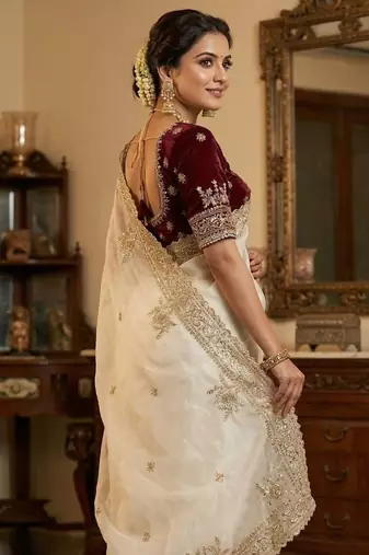 white satin saree with embroidery and heavy border