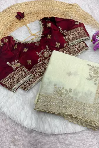 white satin saree with embroidery and heavy border